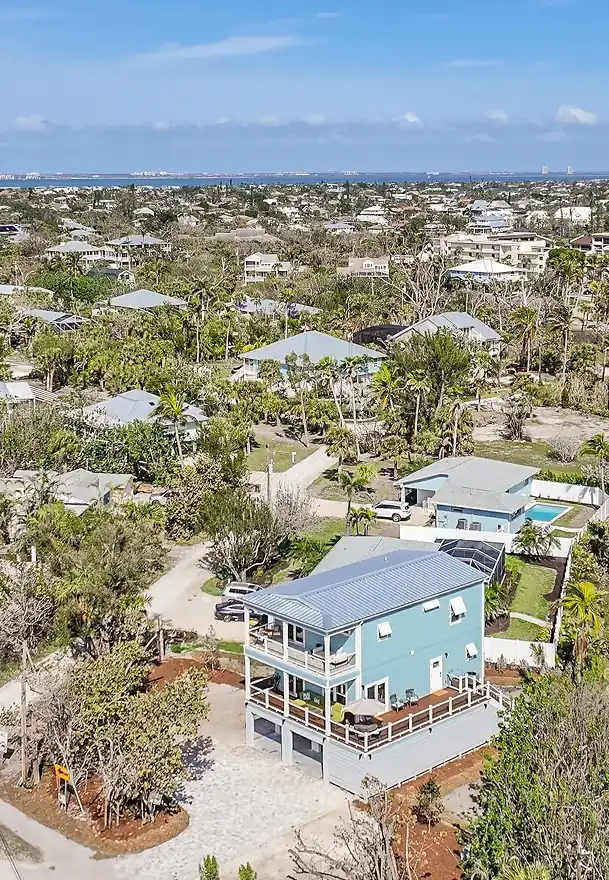 Drone shot of a well-planned residential area featuring newly built homes—showcasing ArmCoa’s impact on modern community development.